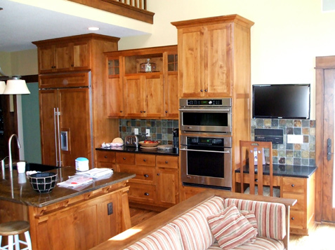 Custom Cabinets staggered heights with symmetrical design detail on center cabinets