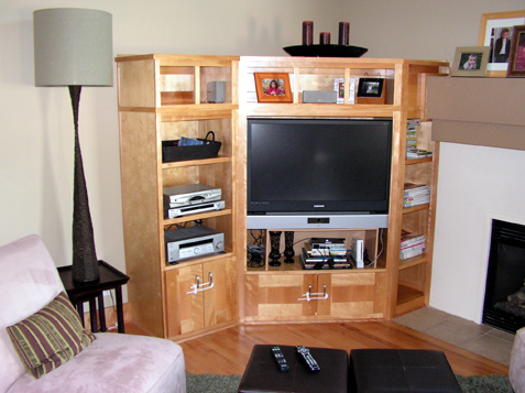 entertainment cabinet in hearth room off kitchen