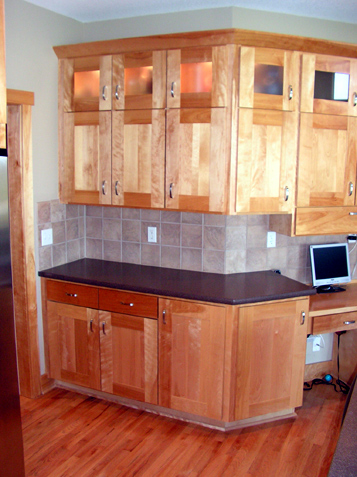Upper Cabinets have lights with Frosted Glass Panels