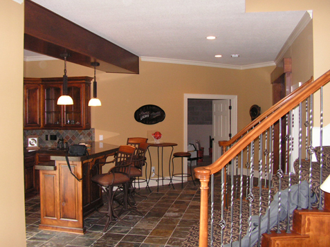 Wrot Iron Spindles on Staircase in Basement with Turnout on Handrail Overland Park, Kansas