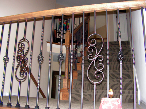 Staircase transformed from wood spindles to iron spindles