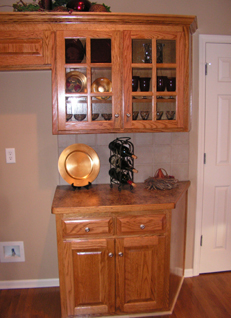 Oak Custom Kitchen showing Glass-Mullioned Doors and Clipped end on Base Cabinet
