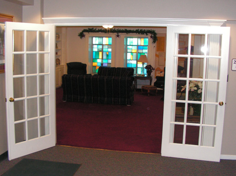 French Doors trimmed with Fluted Accent Trim Pieces and Crown Pediment