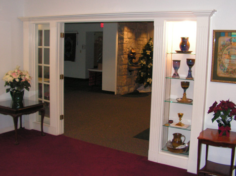 Inside the Parlor - looking out - Side lights on one side with built-in bookcase on other side