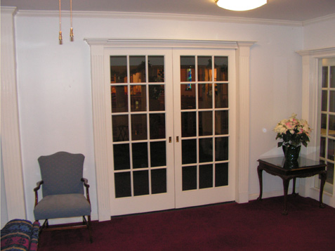 French Doors trimmed with Fluted Accent Trim Pieces and Crown Pediment
