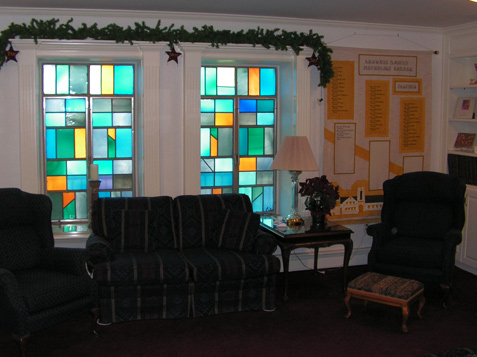 Stained Glass Windows trimmed with Fluted Columns and Crown Molding Pediments