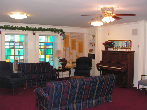 Stained Glass Windows trimmed with Fluted Columns and Crown Molding Pediments